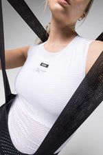 Woman wearing black GOBIK cycling bib shorts with white tank top