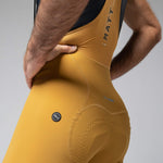 Gobik Matt Compact men's bibshorts in turmeric yellow showing waistband detail and fit