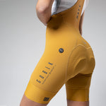Gobik Matt Women's Bib Shorts in Turmeric yellow showing side detail and fit