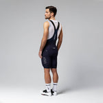 Gobik Matt Compact Men's Bibshorts in Ultrablue showing full rear view with suspenders
