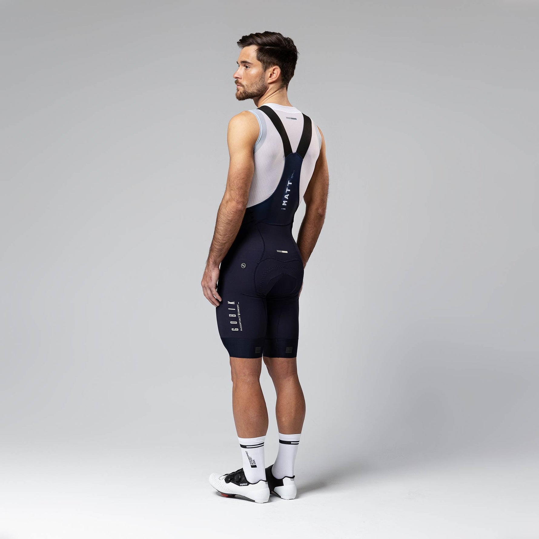 Gobik Matt Compact Men's Bibshorts in Ultrablue showing full rear view with suspenders