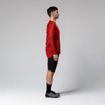 Man wearing red Gobik Terrain long sleeve cycling shirt with black shorts