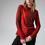 Woman wearing red Gobik Terrain long sleeve t-shirt with textured fabric pattern
