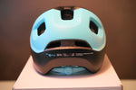 POC Axion Spin cycling helmet in light blue matte finish on white background