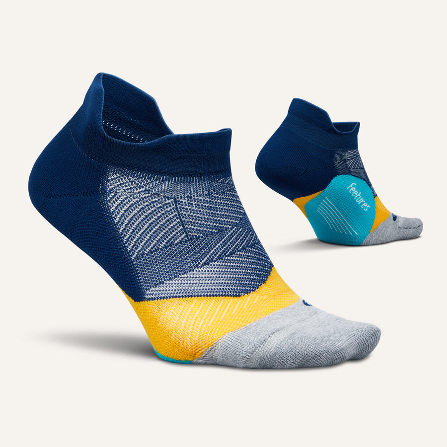 Feetures Elite Light Cushion Tab socks in navy blue with colorful striped design