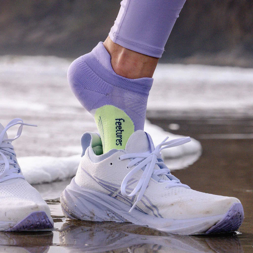 Feetures Elite Light Cushion Tab socks in lavender purple with green heel detail
