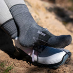 Gray Feetures Trail Max Cushion Mini Crew socks worn with hiking shoes outdoors