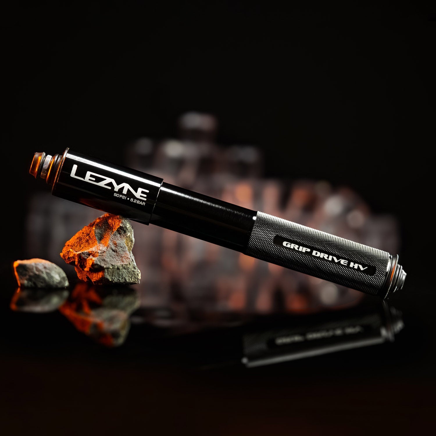 Lezyne Grip Drive HV black bicycle pump with textured grip handle on dark background