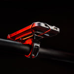 Lezyne Smart Grip Mount with red LED lighting on black background