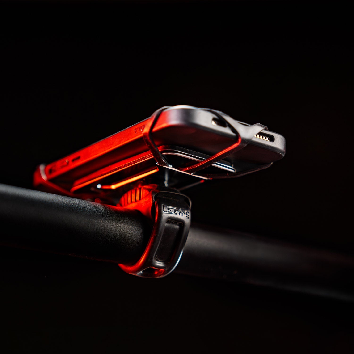 Lezyne Smart Grip Mount with red LED lighting on black background