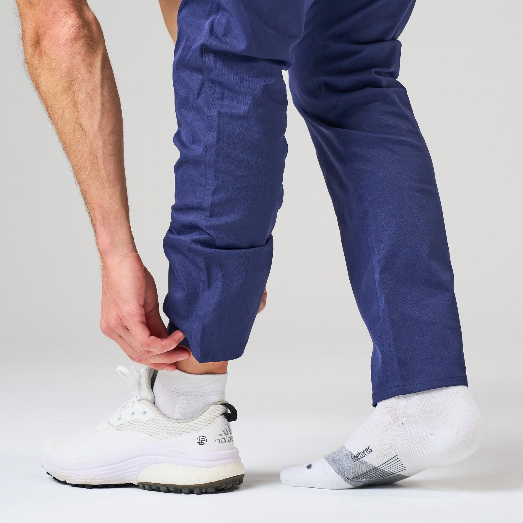 White Feetures Elite Max Cushion low cut socks worn with athletic shoes