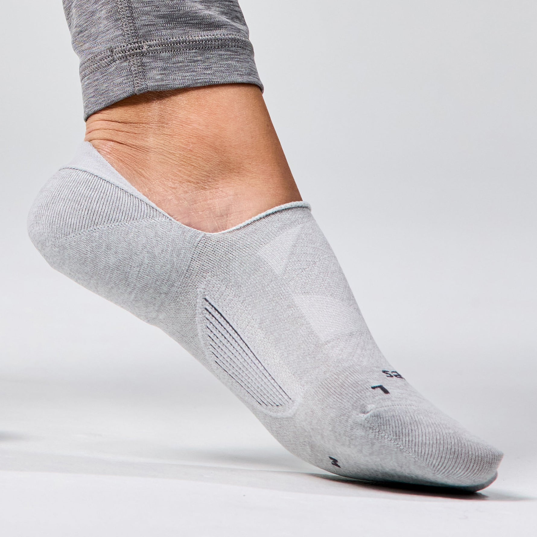 Gray Feetures Elite Light Cushion no-show running sock on foot in profile