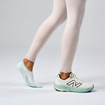 Feetures Elite Light Cushion Invisible sock in Ice color worn with New Balance sneakers
