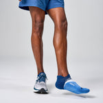 Feetures Elite Light Cushion Tab socks in boost blue worn by runner