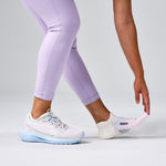 Feetures Elite Light Cushion Tab no-show socks in Lilac Breeze colorway on model wearing running shoes
