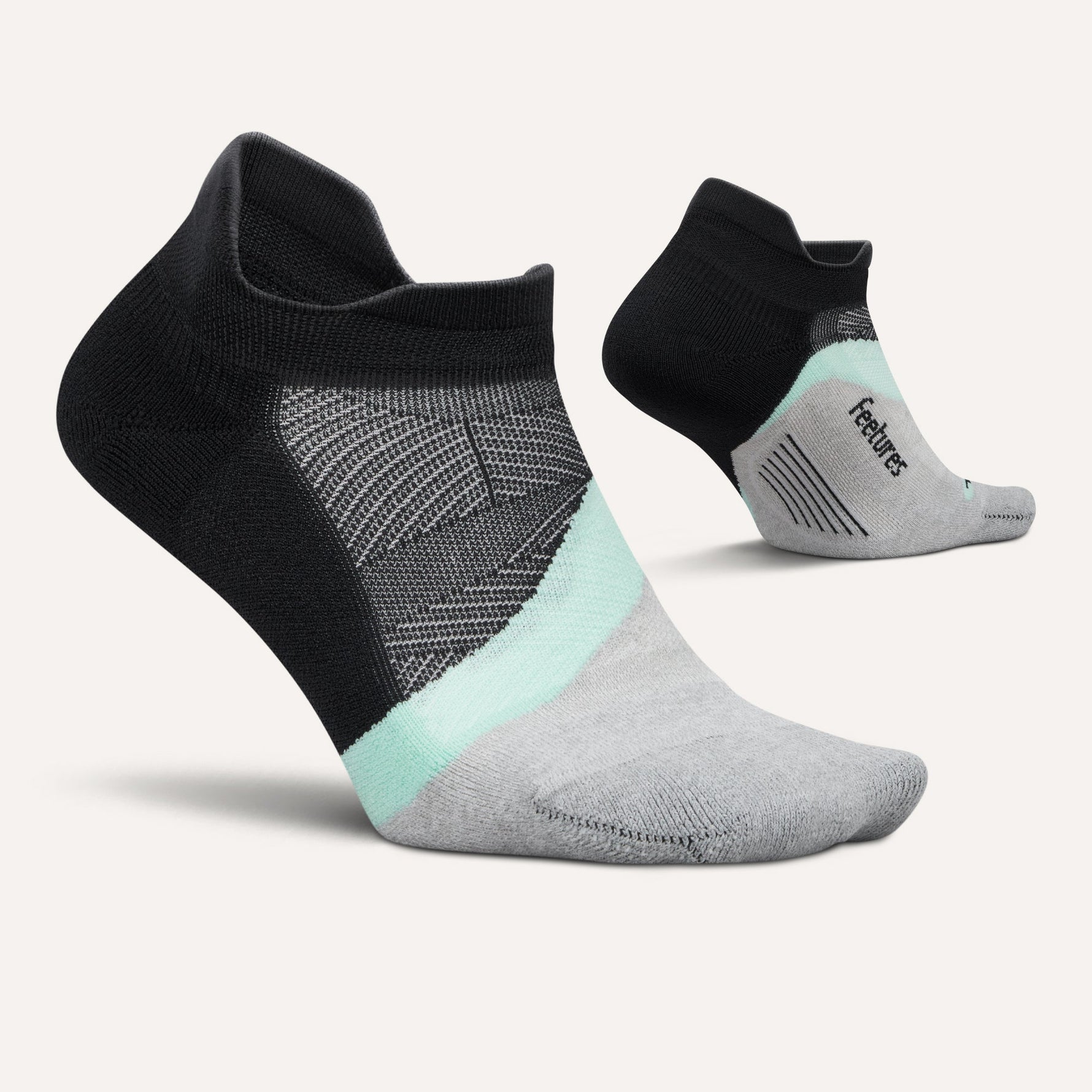 Feetures Elite Light Cushion Tab running socks in black with mint and grey color blocking