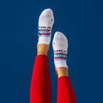 White Feetures Elite Light Cushion Tab socks with patriotic USA striped design