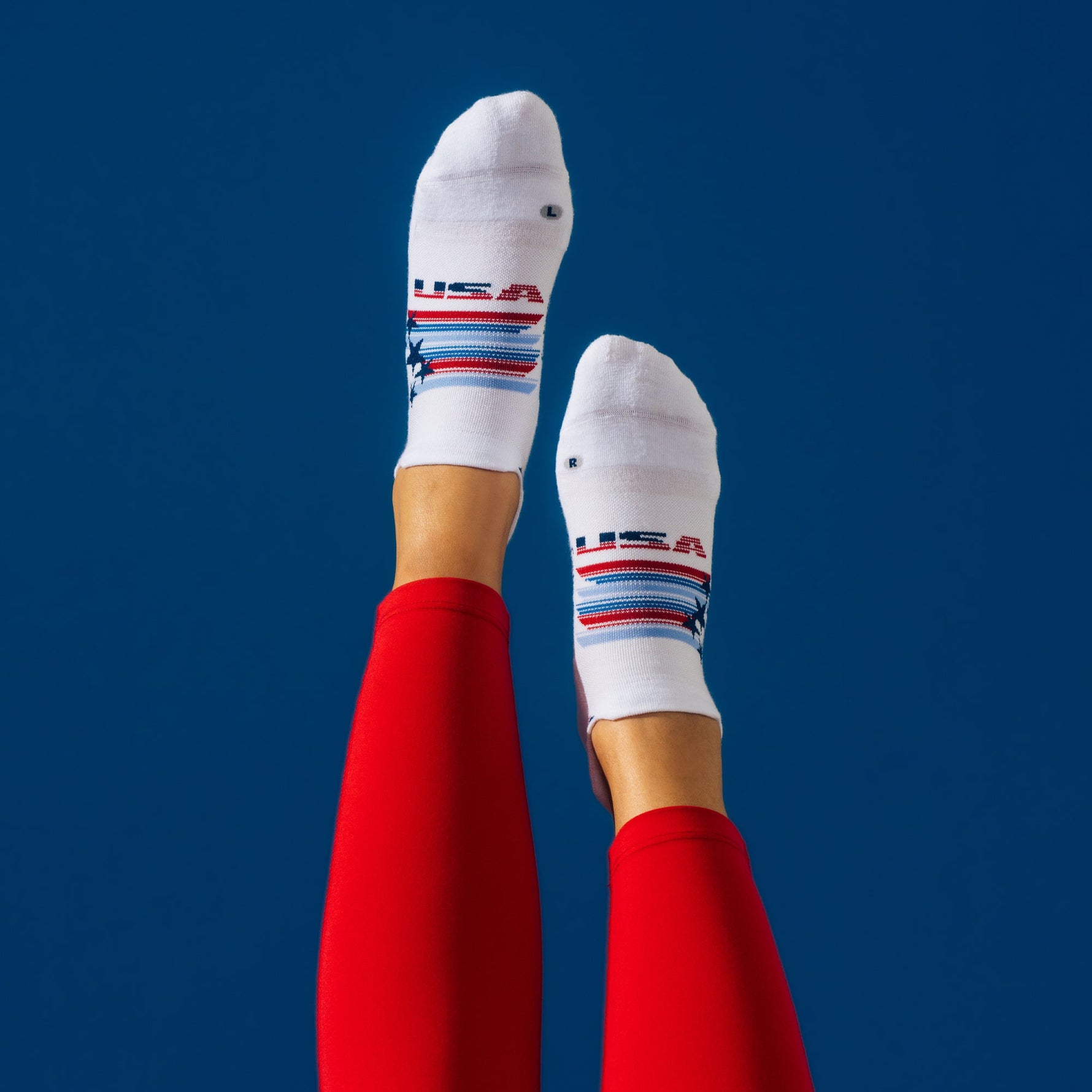 White Feetures Elite Light Cushion Tab socks with patriotic USA striped design