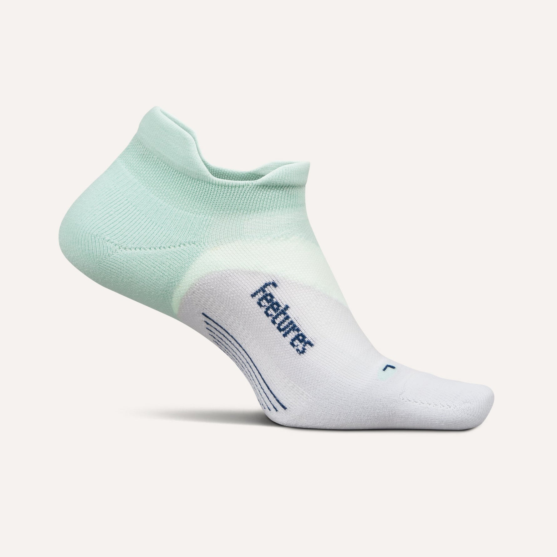 Feetures Elite Light Cushion No-Show Tab sock in mint green and white colorway