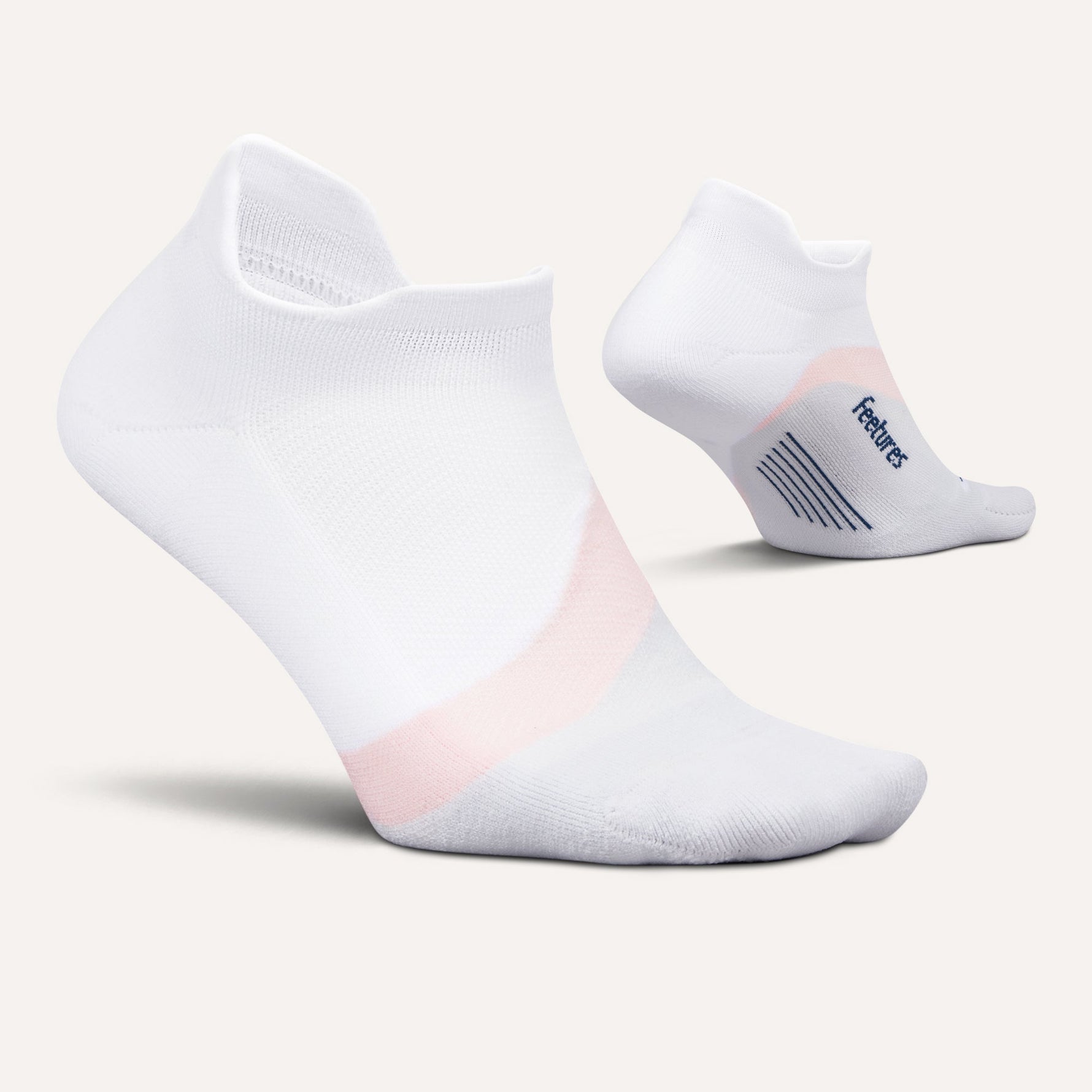 Feetures Elite Light Cushion Tab socks in white with pink accents on clean background