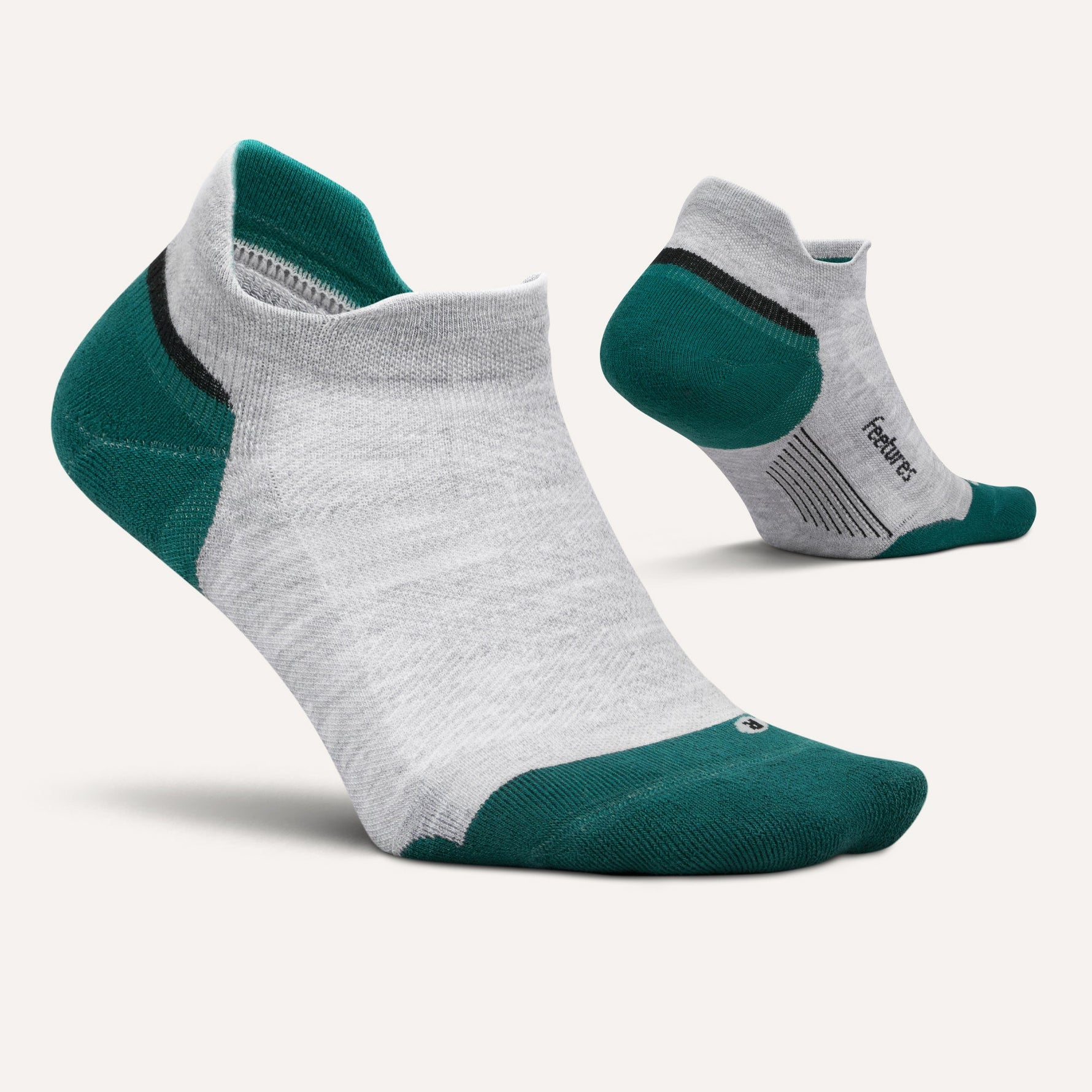 Feetures Elite Max Cushion Tab socks in light grey with teal accents