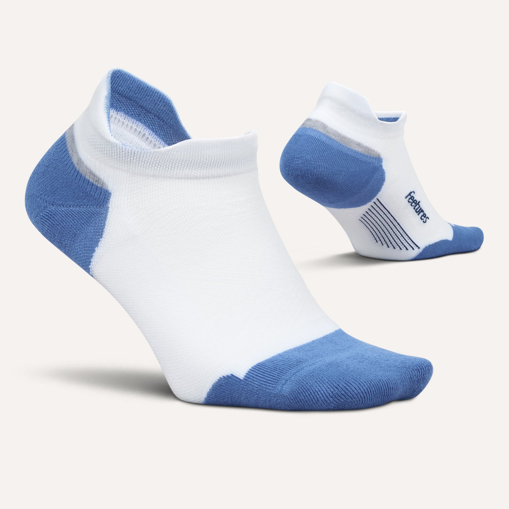 Feetures Elite Max Cushion Tab socks in white with blue heel and toe