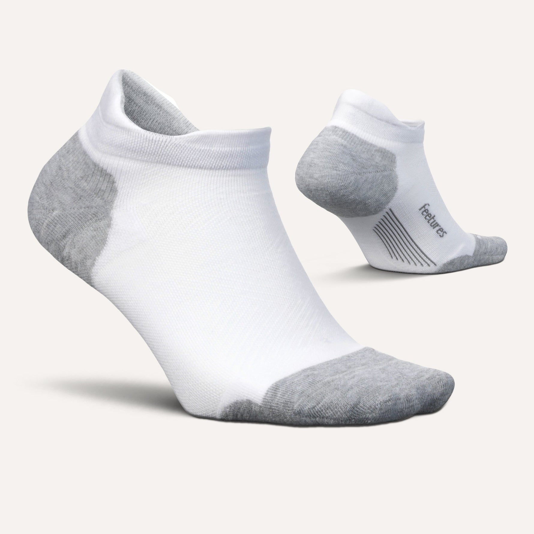 Feetures Elite Max Cushion Tab socks in white and grey colorway