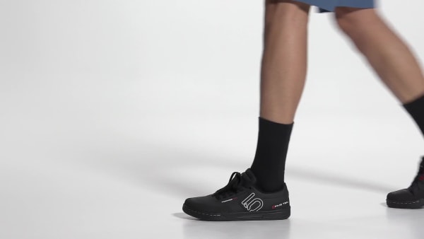 Five Ten Freerider Pro MTB shoes in black on model's feet