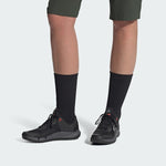 Five Ten Trailcross LT shoes in black and grey worn with dark socks