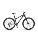 GT Avalanche Comp black mountain bike with 29-inch wheels on white background