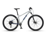 GT Avalanche mountain bike with light gray frame and blue accents on white background