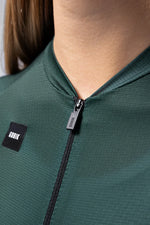 Gobik Infinity cycling jersey in bunker green with quarter zip and logo detail