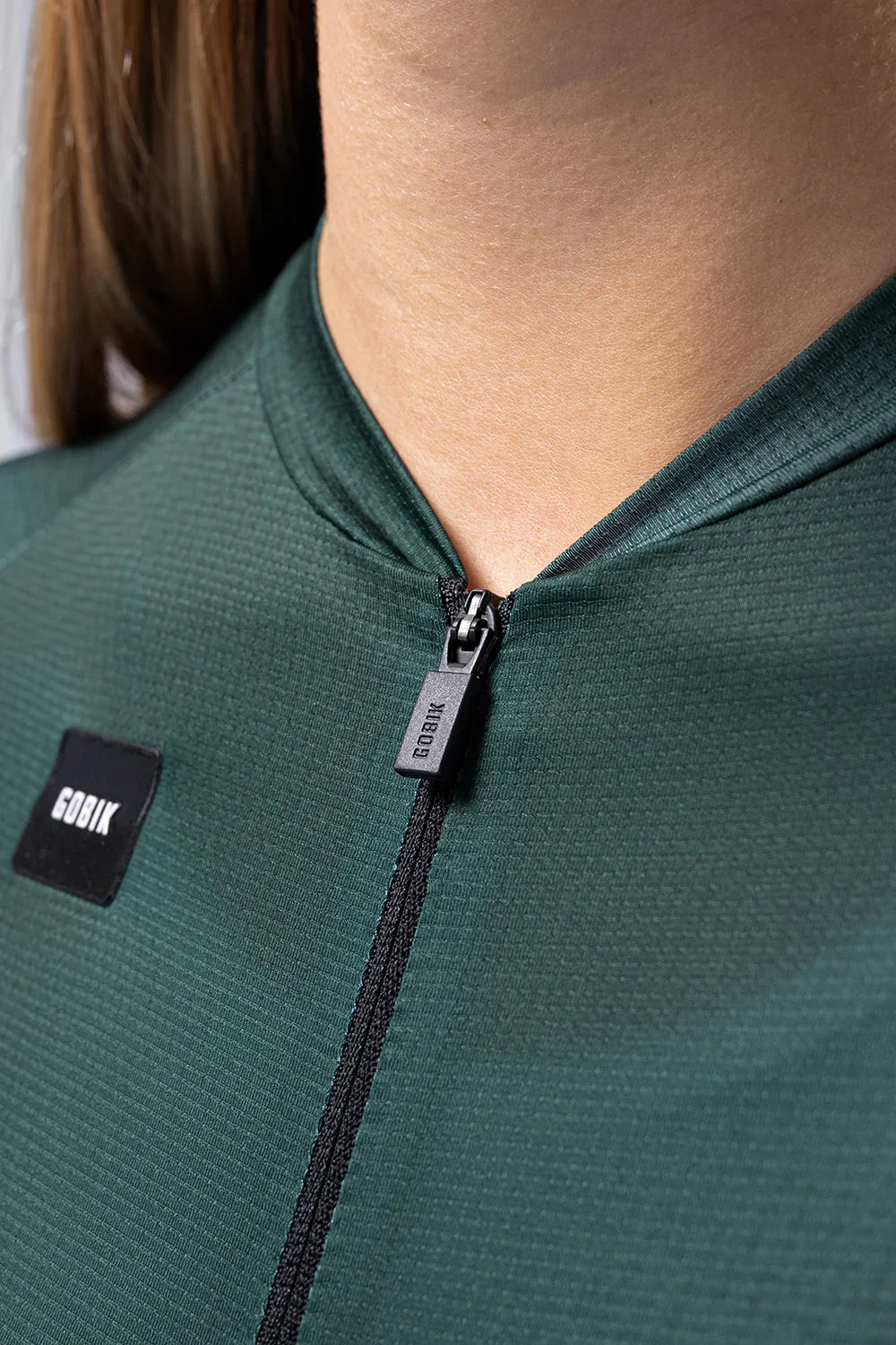 Gobik Infinity cycling jersey in bunker green with quarter zip and logo detail