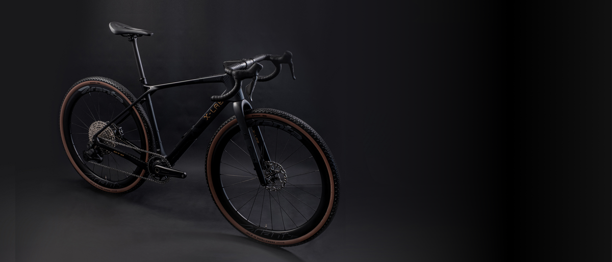 X-LAB GT8 gravel bike in Afterburner Black displayed on dark studio background, three-quarter view