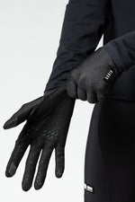 Black Gobik Lynx cycling gloves with textured grip palms on model hands