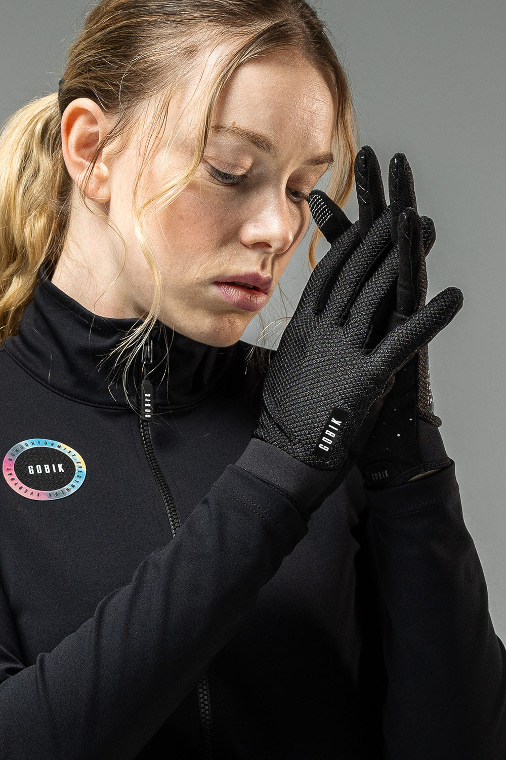Woman wearing black Gobik Lynx gloves with textured grip palms