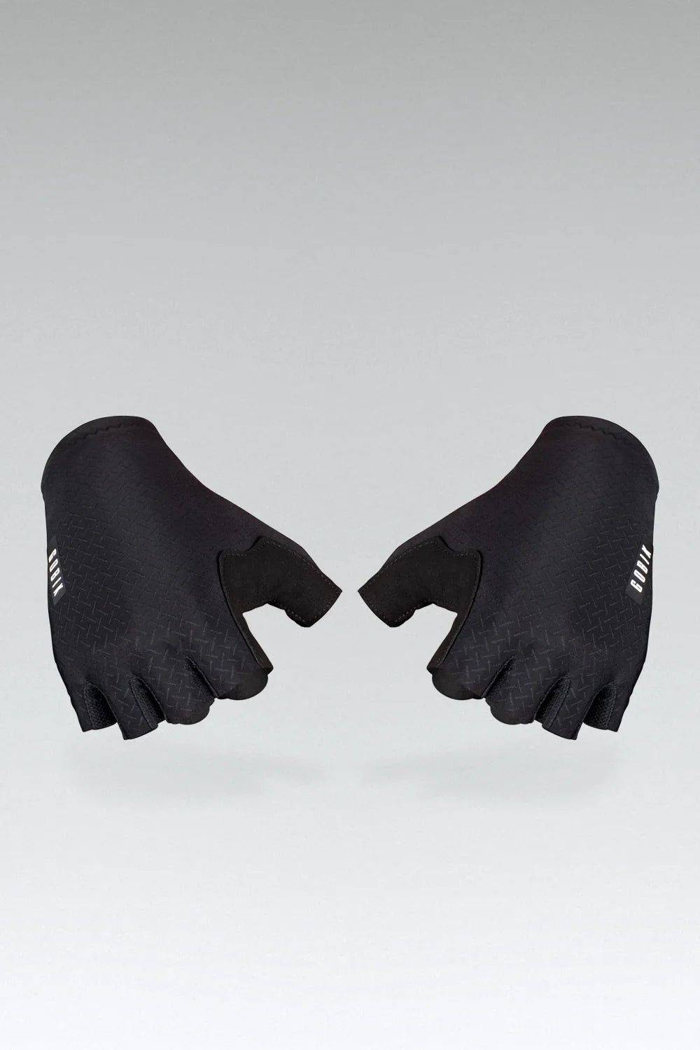 Black cycling gloves with textured grip pattern displayed on gray background