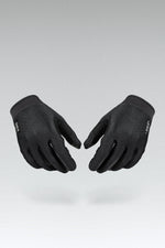 Gobik Lynx black cycling gloves with textured grip palms displayed on gray background