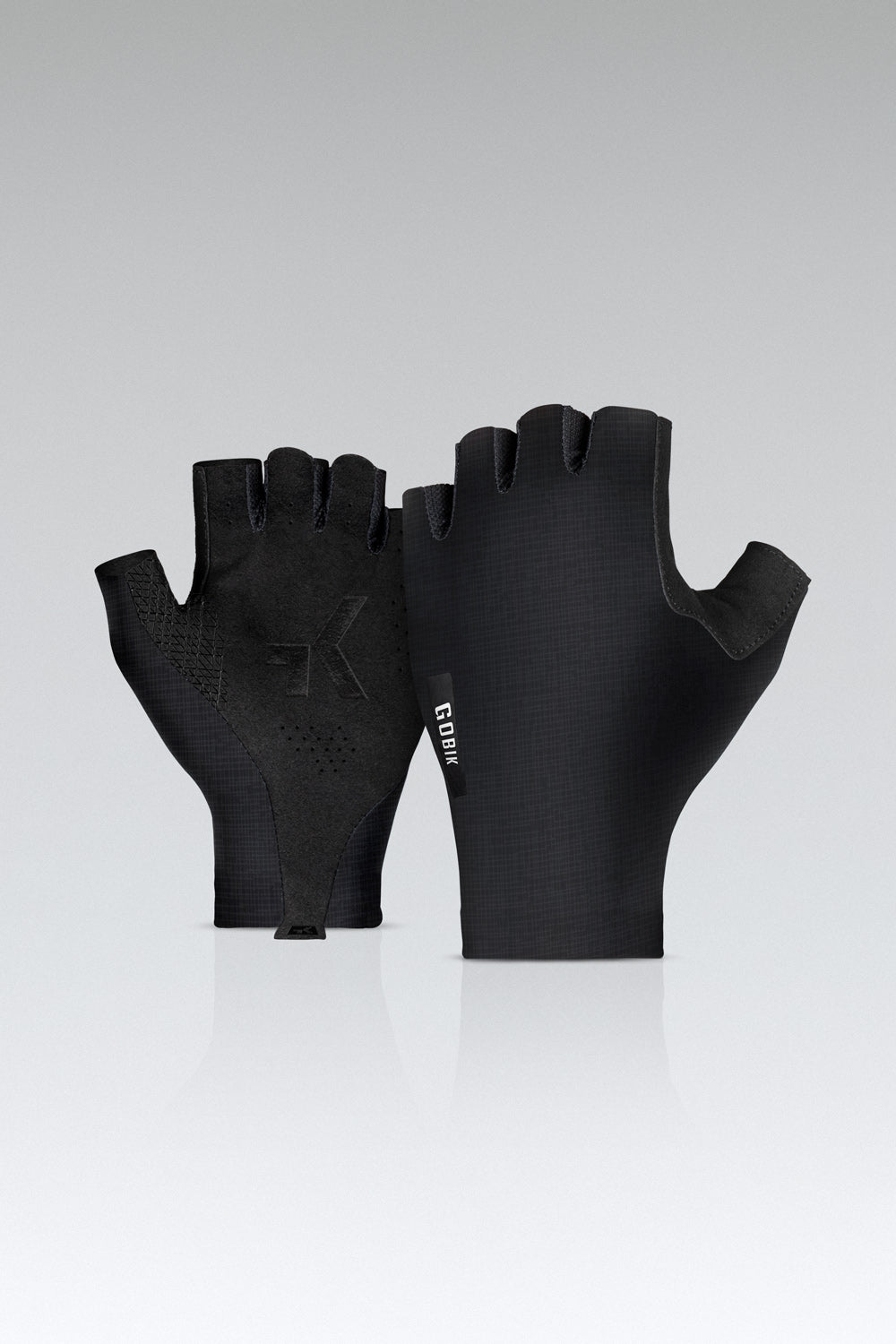 Black Gobik cycling gloves with fingerless design and textured palm grip