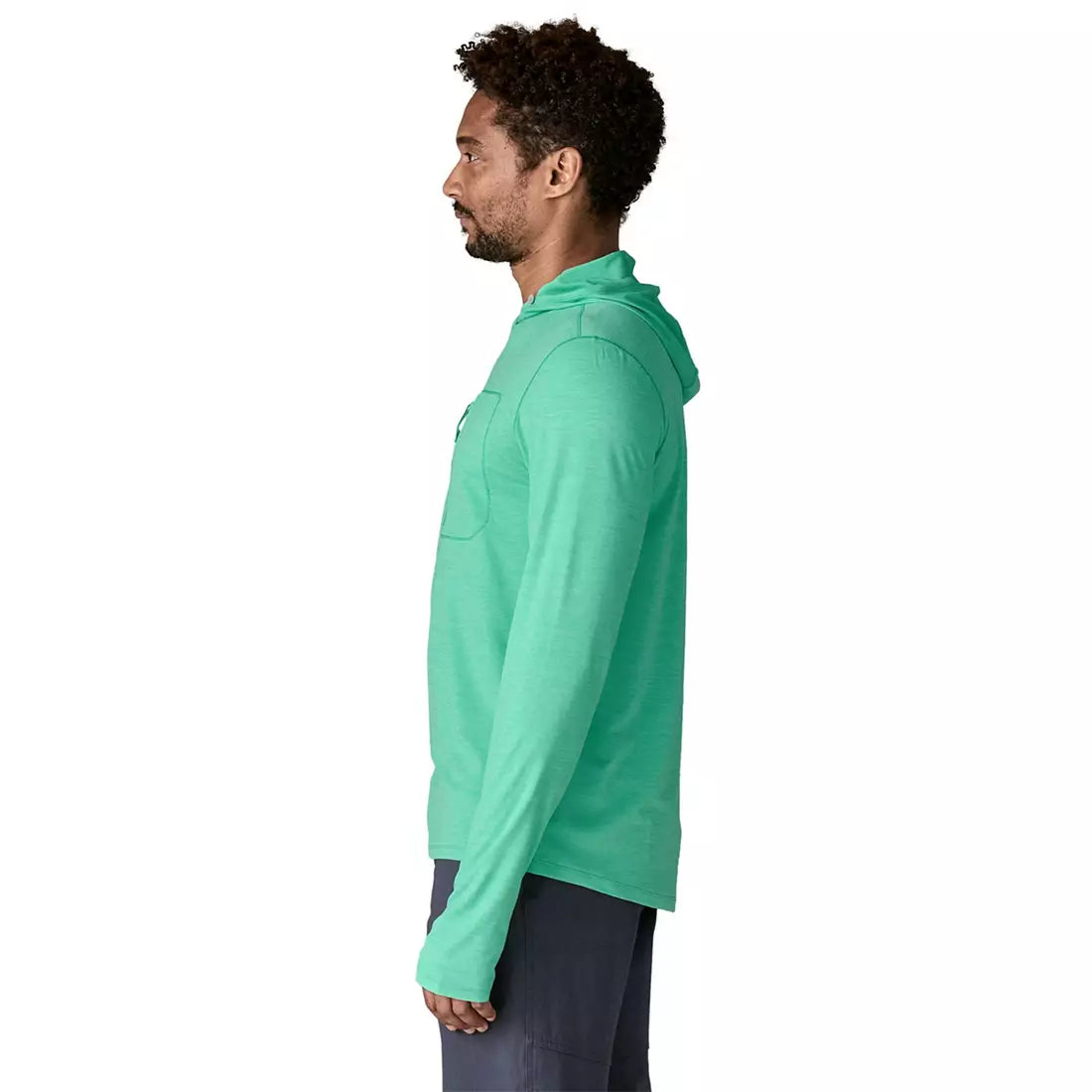 Man wearing turquoise Patagonia Cap Cool Sun Hoody, side profile view on white background