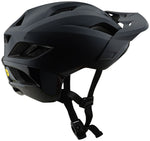 Troy Lee Designs Flowline SE helmet stealth black, angled rear three-quarter view showing MIPS