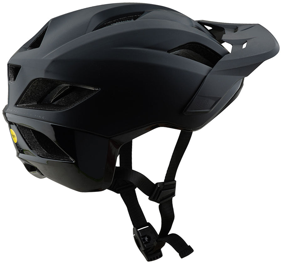 Troy Lee Designs Flowline SE helmet stealth black, angled rear three-quarter view showing MIPS