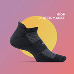 Feetures black high performance ankle sock with mesh ventilation on gradient background