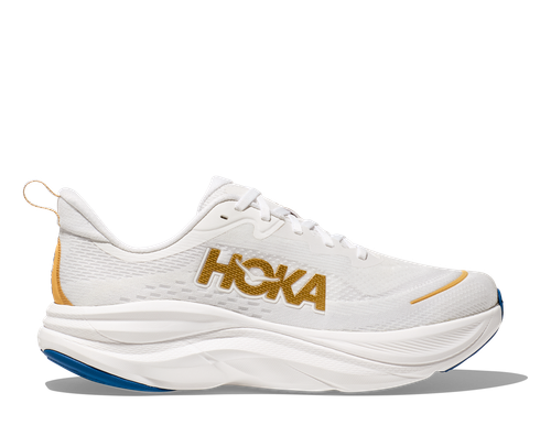 HOKA Skyflow running shoe in frost white with gold logo and orange details