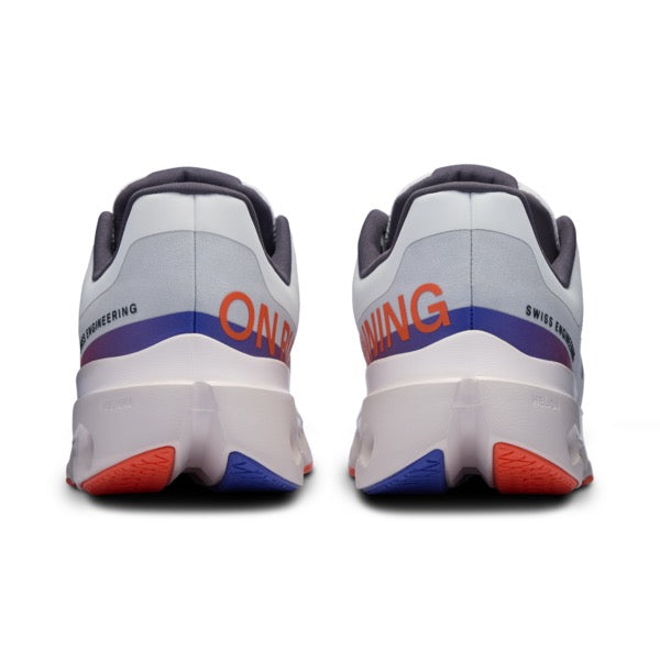 On Cloudsurfer Next running shoes in white with orange and blue details, rear view