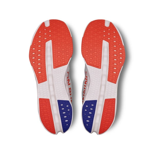 On Cloudsurfer Next Men's running shoe outsole view showing white, flame red, and blue rubber