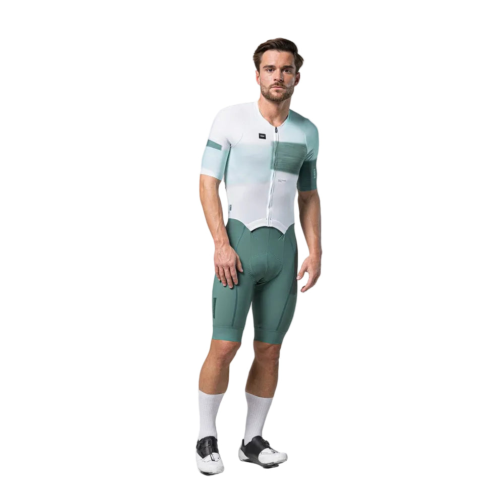Male cyclist wearing Gobik Aero Brooklyn cycling suit in emerald and white