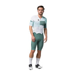 Male cyclist wearing Gobik Aero Brooklyn cycling suit in emerald and white