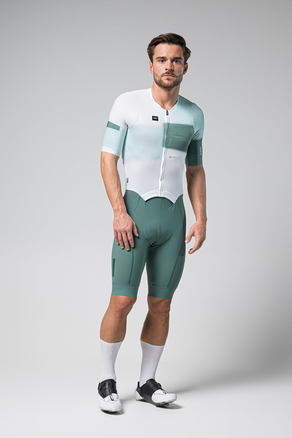 Man wearing Gobik Brooklyn Aerosuit in white and sage green gradient design