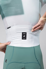 Gobik cycling suit with white top and teal shorts showing waist detail
